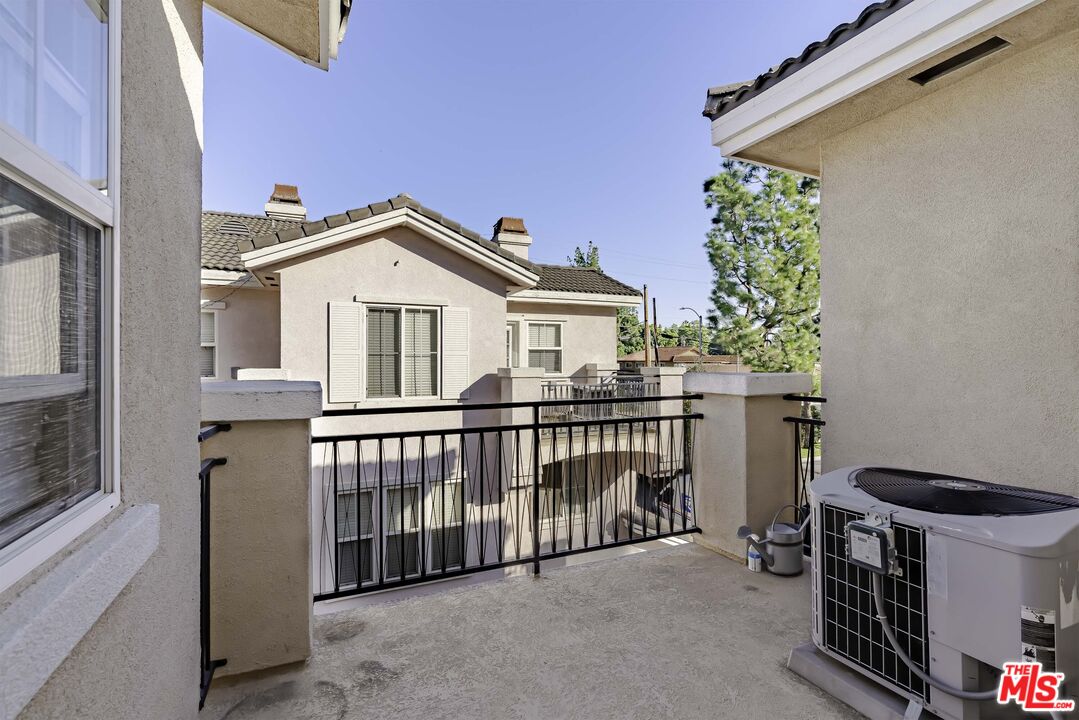 2155 Associated Road Fullerton, CA 92831 - Photo 30 of 47 a view of a house with a small yard and a potted plant