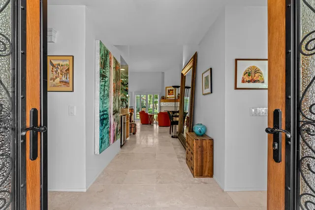 a view of a hallway with paintings on the wall