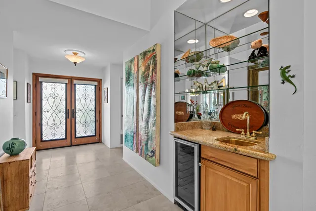 a view of a bathroom with a sink and mirror