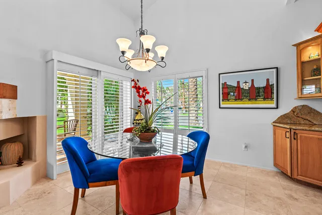 a view of a dining room with furniture wooden floor and chandelier