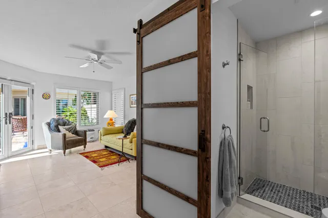 a building outdoor space with patio furniture and potted plants