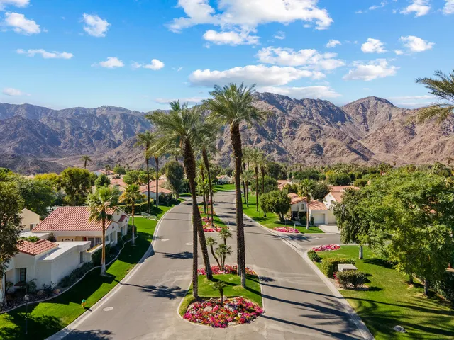 a view of a patio with a table and chairs