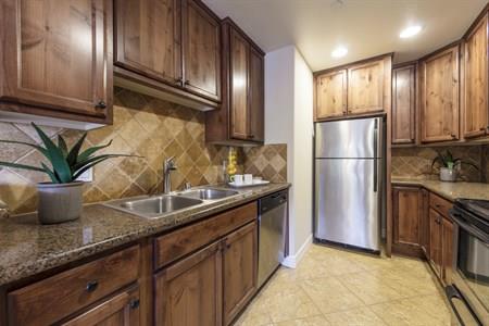 2580 Homestead Road, Unit 4204 Santa Clara, CA 95051 - Photo 11 of 19 a kitchen with stainless steel appliances granite countertop a refrigerator a stove and a sink