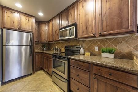 2580 Homestead Road, Unit 4204 Santa Clara, CA 95051 - Photo 12 of 19 a kitchen with granite countertop stainless steel appliances a refrigerator a stove a sink and cabinets