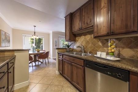2580 Homestead Road, Unit 4204 Santa Clara, CA 95051 - Photo 13 of 19 a kitchen with granite countertop a sink cabinets and window