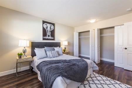 2580 Homestead Road, Unit 4204 Santa Clara, CA 95051 - Photo 14 of 19 a bedroom with a bed and wooden floor