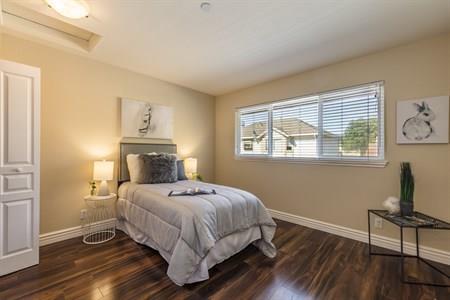 2580 Homestead Road, Unit 4204 Santa Clara, CA 95051 - Photo 15 of 19 a bedroom with a bed and wooden floor