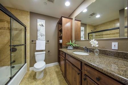 2580 Homestead Road, Unit 4204 Santa Clara, CA 95051 - Photo 16 of 19 a bathroom with a granite countertop sink toilet and shower