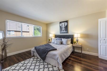 2580 Homestead Road, Unit 4204 Santa Clara, CA 95051 - Photo 17 of 19 a bedroom with a bed and wooden floor