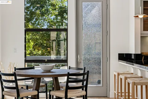 a view of a dining room with furniture and window