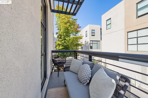 a view of balcony with furniture