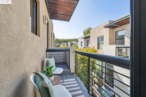 a view of balcony with furniture