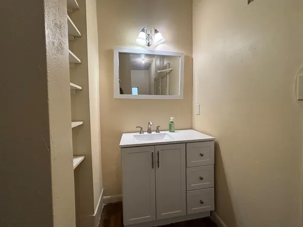 a bathroom with a sink and a mirror