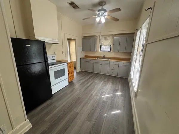 a kitchen with a refrigerator a sink and dishwasher