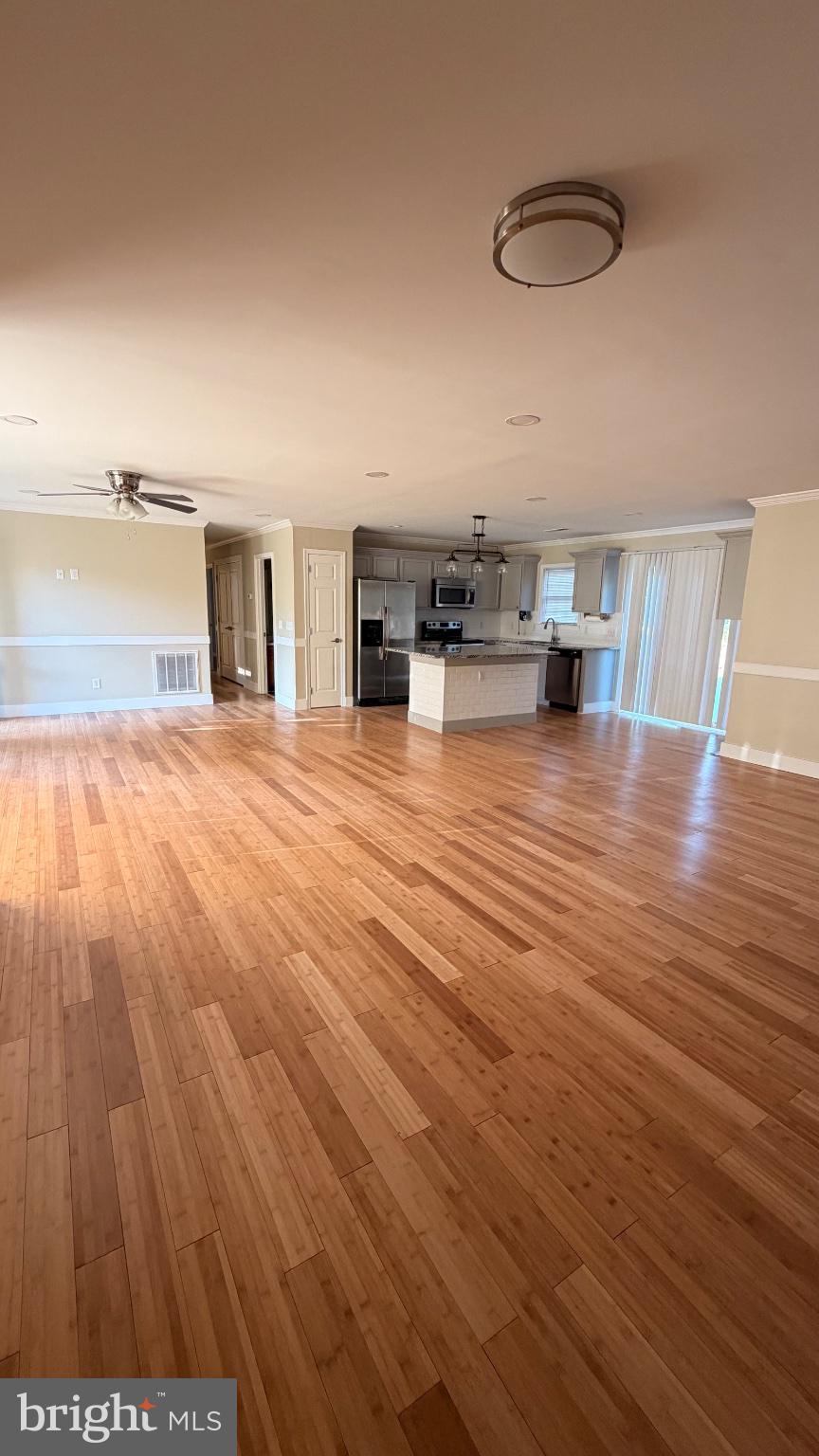 1110 High Street Cambridge, MD 21613 - Photo 6 of 22 Spacious open layout with warm tones.