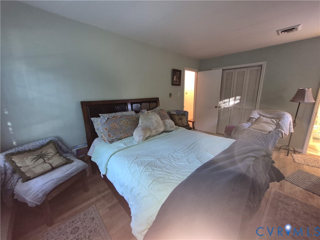 3818 Cedar Grove Road Richmond, VA 23235 - Photo 13 of 20 a bed sitting in a bedroom next to a window