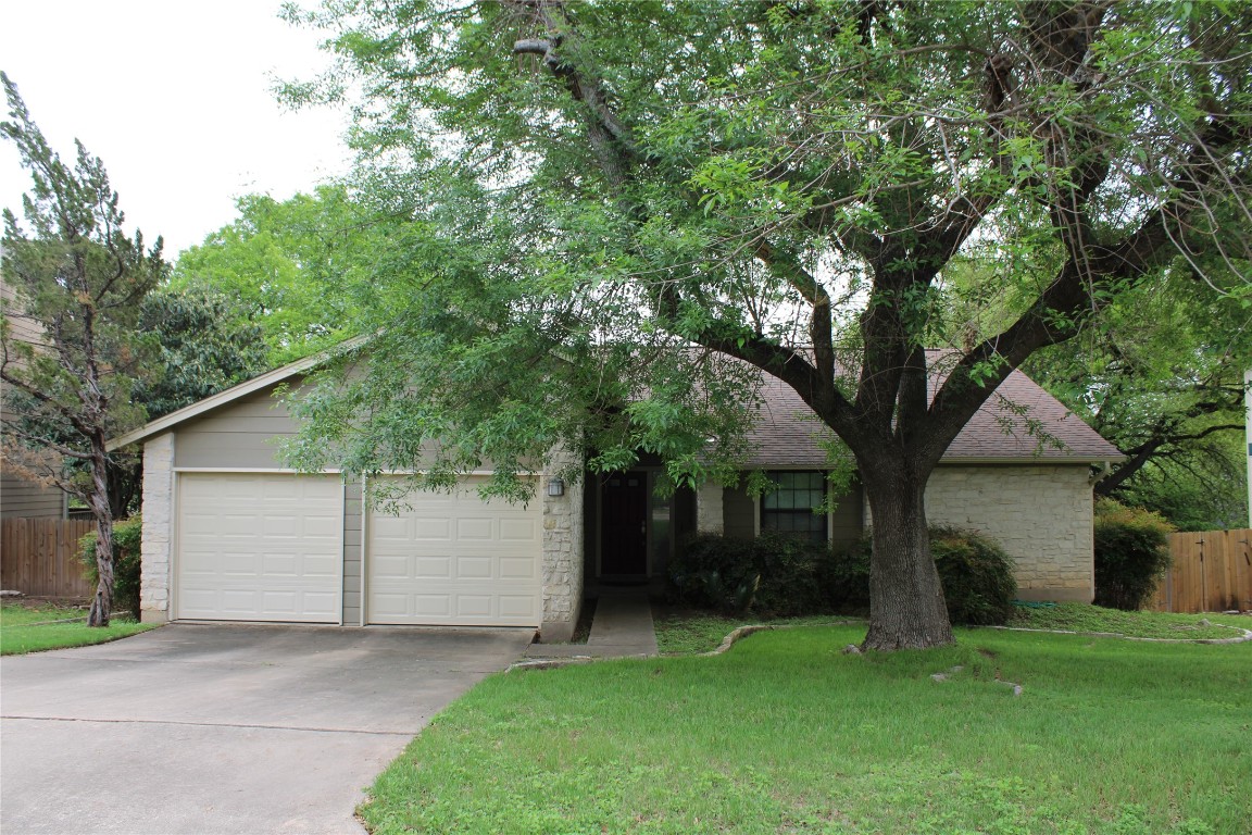 12001 Cherie Drive Austin, TX 78758 - Photo 1 of 1 a white house that has a tree in front of it