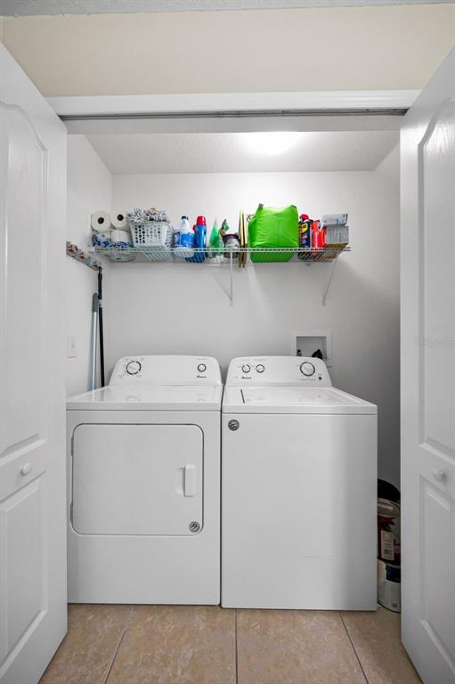 9736 Trumpet Vine Loop Trinity, FL 34655 - Photo 22 of 35 a utility room with dryer and washer