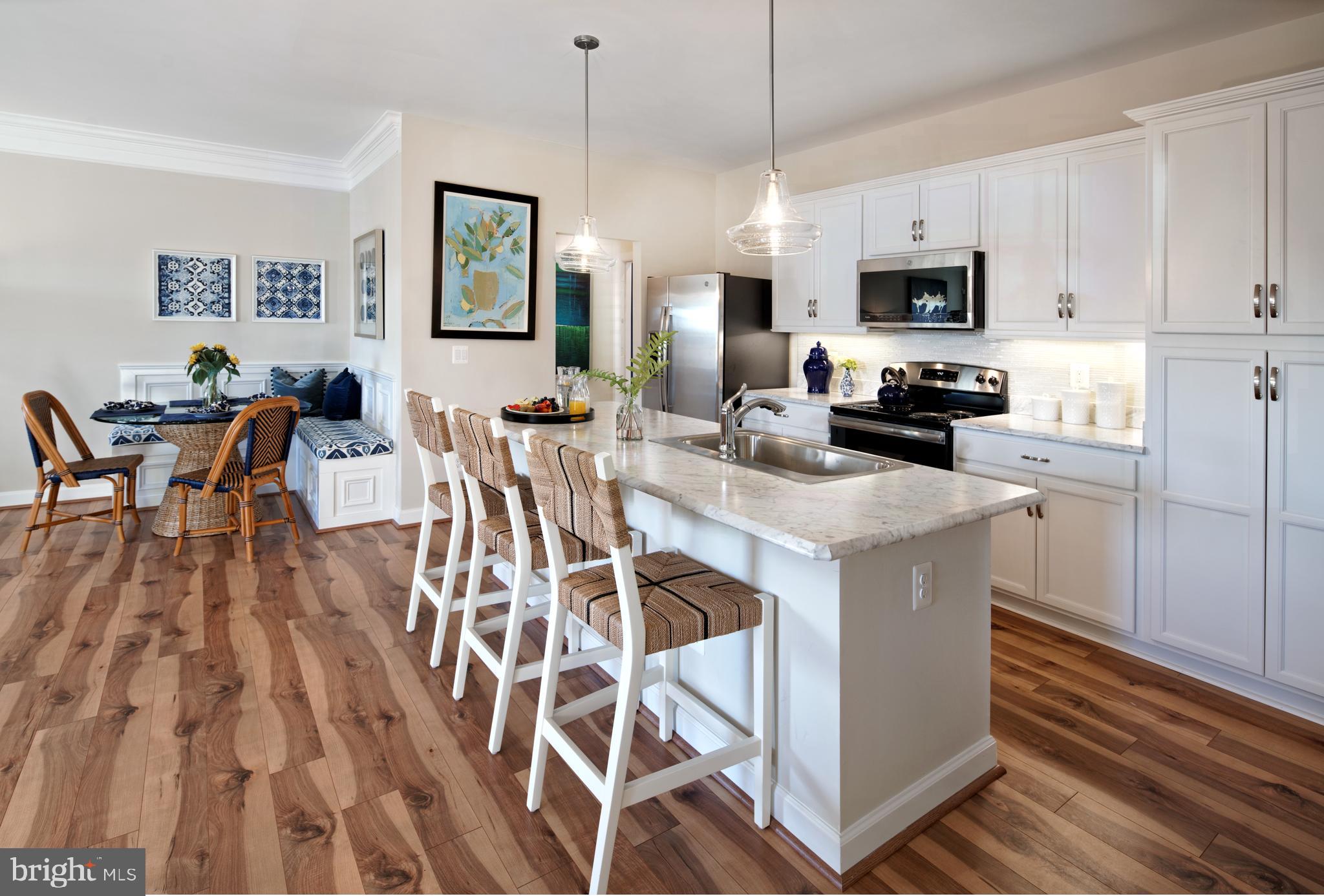 109 Fetlock Drive Stephenson, VA 22656 - Photo 2 of 19 a kitchen with stainless steel appliances kitchen island granite countertop a stove a sink a dining table and chairs