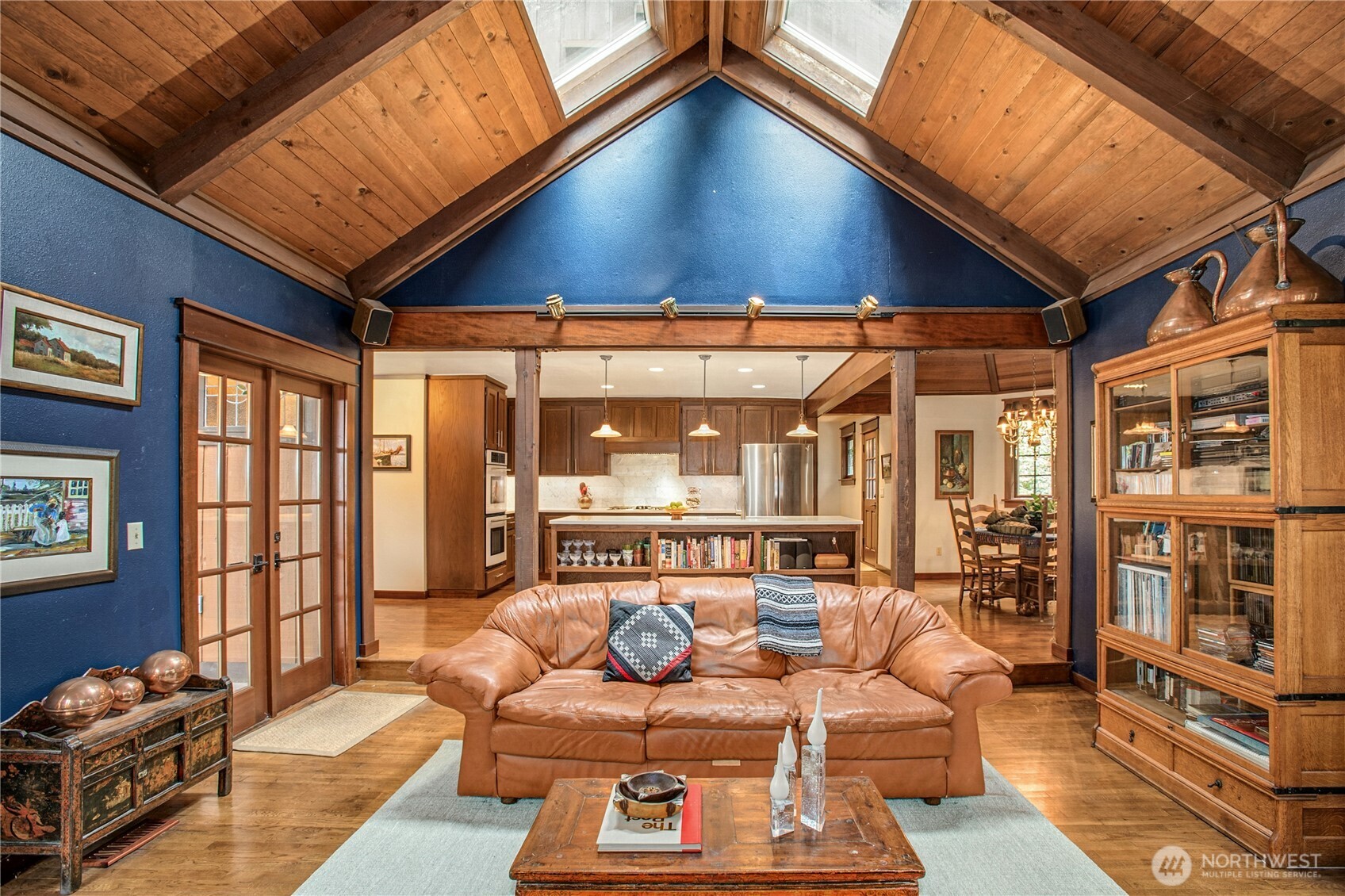 1815 102nd Place Southeast Bellevue, WA 98004 - Photo 18 of 40 a living room with furniture a ceiling fan and a rug