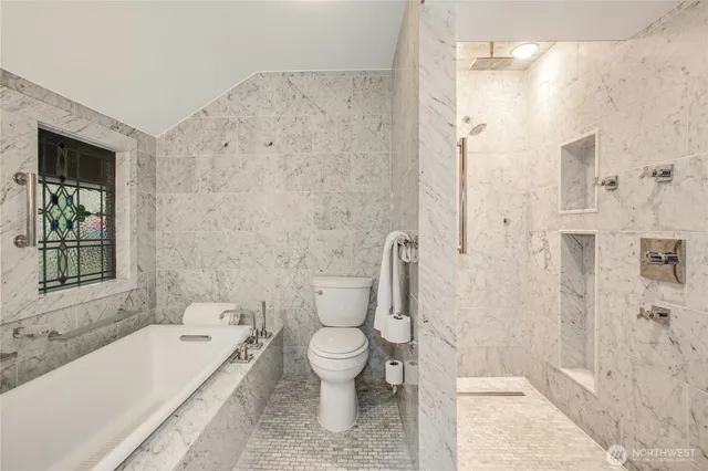 a bathroom with a toilet and a bathtub