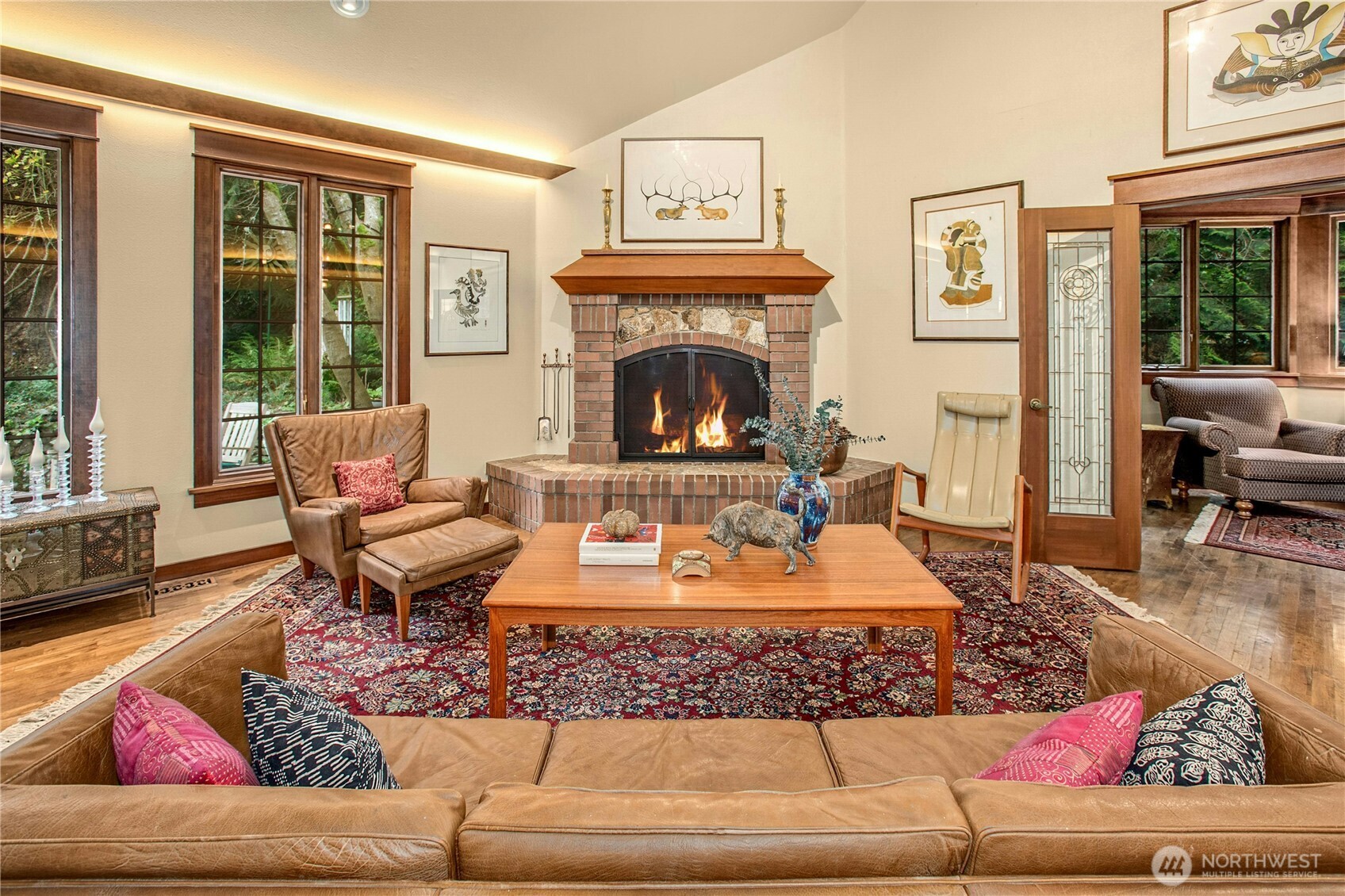 1815 102nd Place Southeast Bellevue, WA 98004 - Photo 8 of 40 a living room with furniture a rug and a fireplace