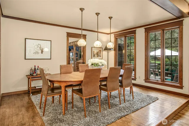 a view of a dining room with furniture window and wooden floor