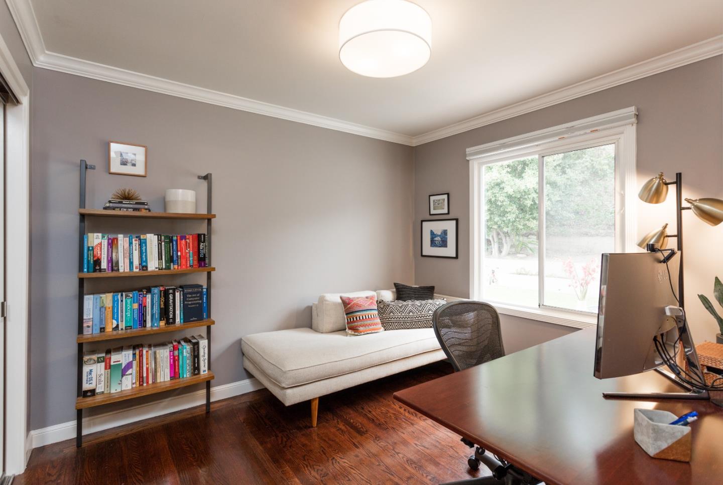 560 Macarthur Drive Daly City, CA 94015 - Photo 12 of 18 a living room with furniture and a book shelf