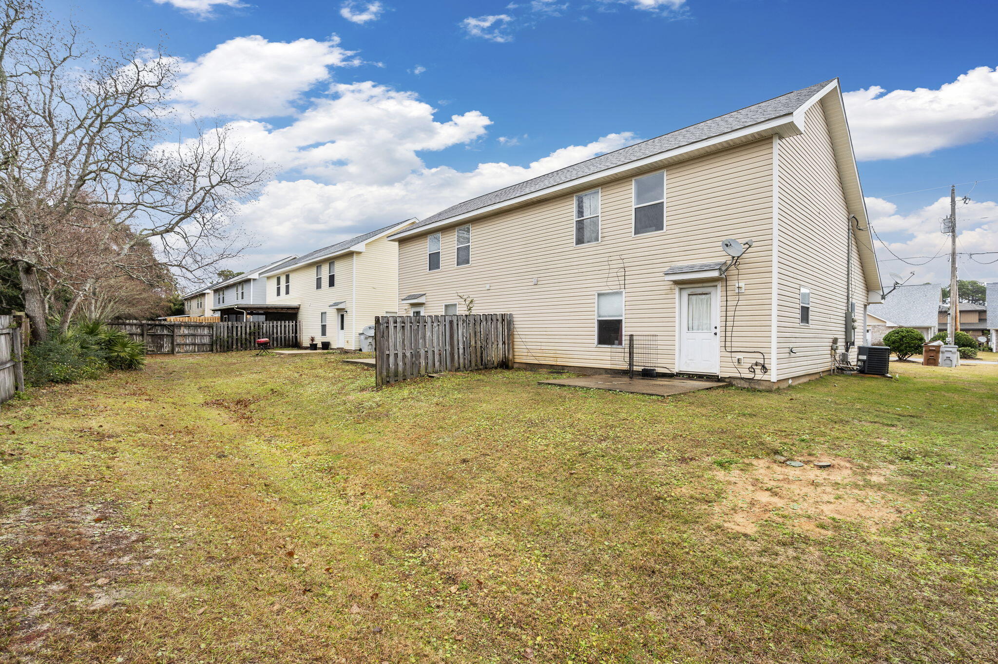 2139 Tom Street Navarre, FL 32566 - Photo 27 of 32 a view of a house with backyard