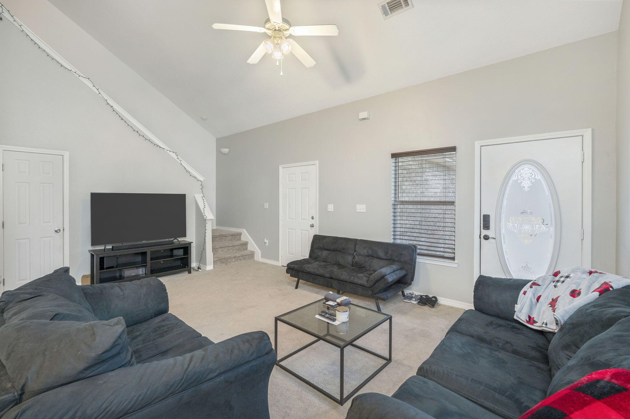 2139 Tom Street Navarre, FL 32566 - Photo 28 of 32 a living room with furniture and a flat screen tv