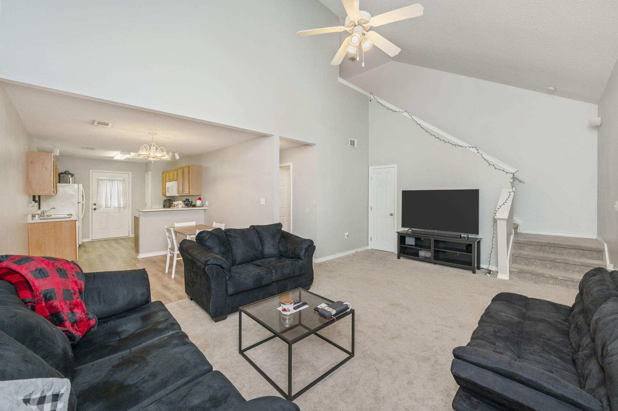 2139 Tom Street Navarre, FL 32566 - Photo 29 of 32 a living room with furniture and a flat screen tv