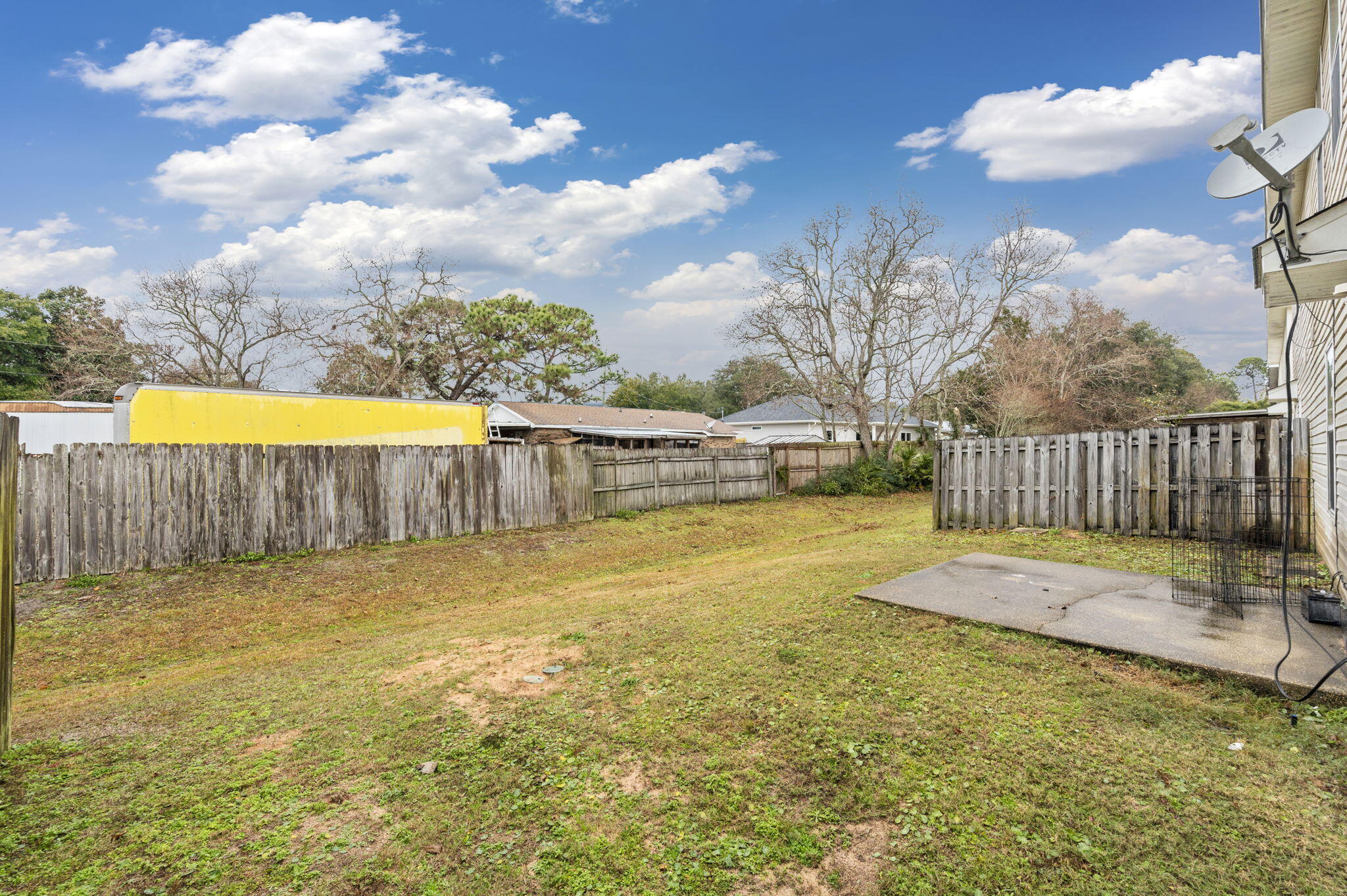 2139 Tom Street Navarre, FL 32566 - Photo 30 of 32 a view of a swimming pool with a yard