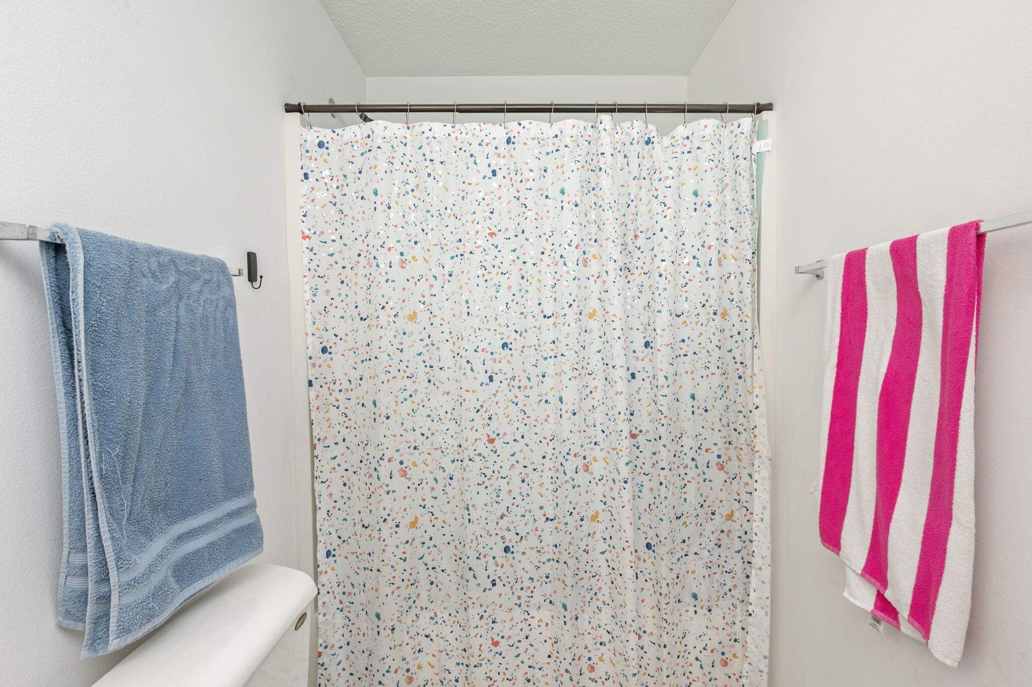 2139 Tom Street Navarre, FL 32566 - Photo 4 of 32 a bathroom with a shower curtain and a curtain