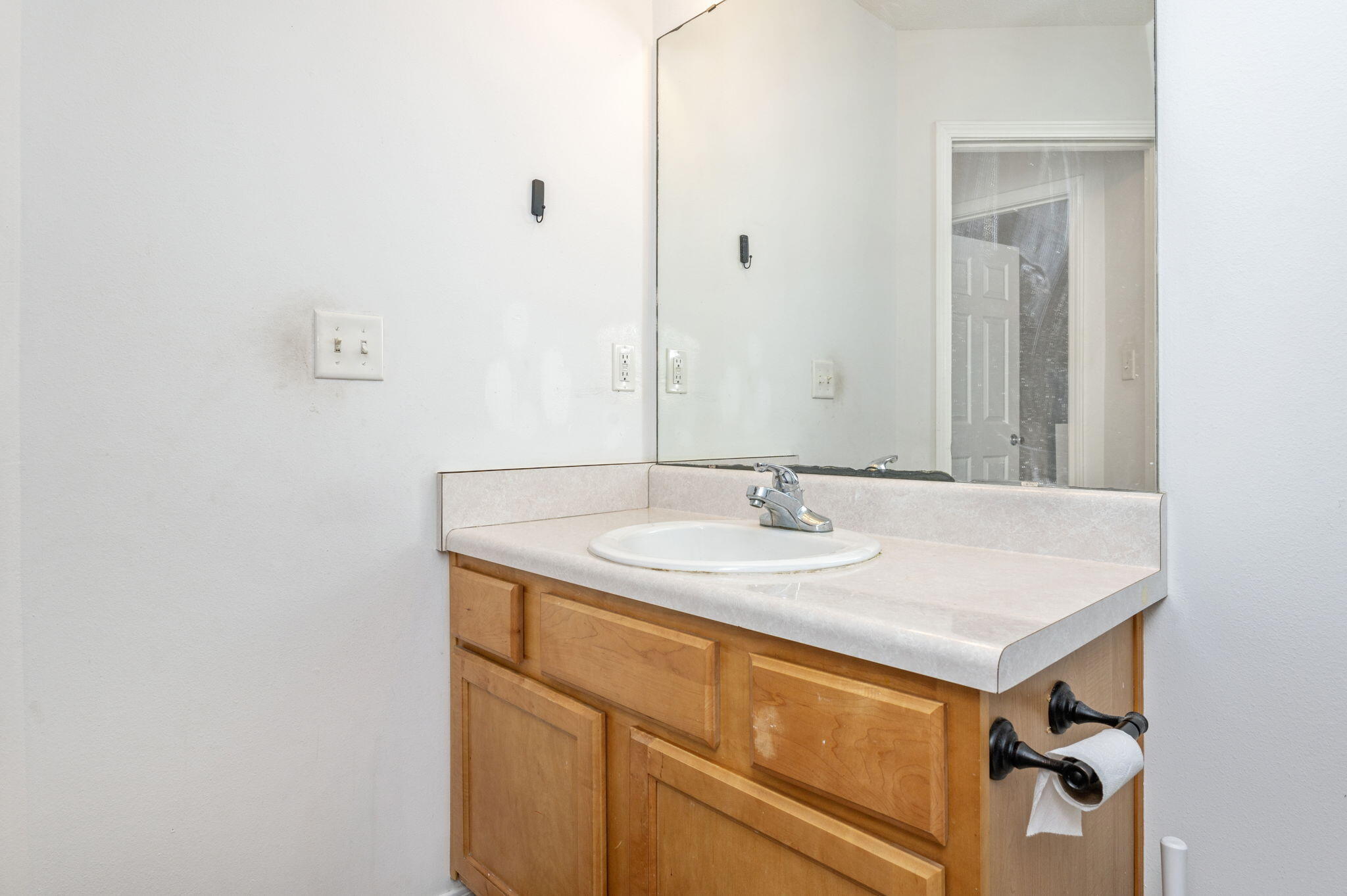 2139 Tom Street Navarre, FL 32566 - Photo 5 of 32 a bathroom with a sink and a mirror