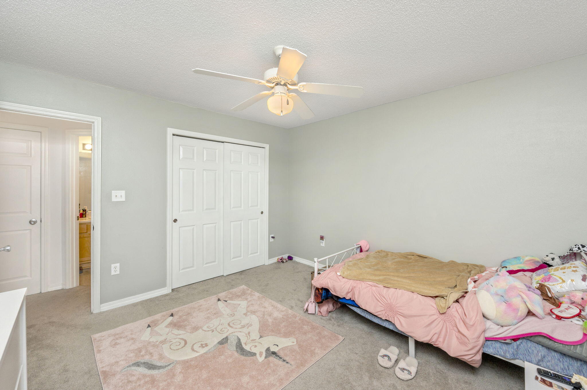 2139 Tom Street Navarre, FL 32566 - Photo 6 of 32 a bedroom with a bed and a chandelier