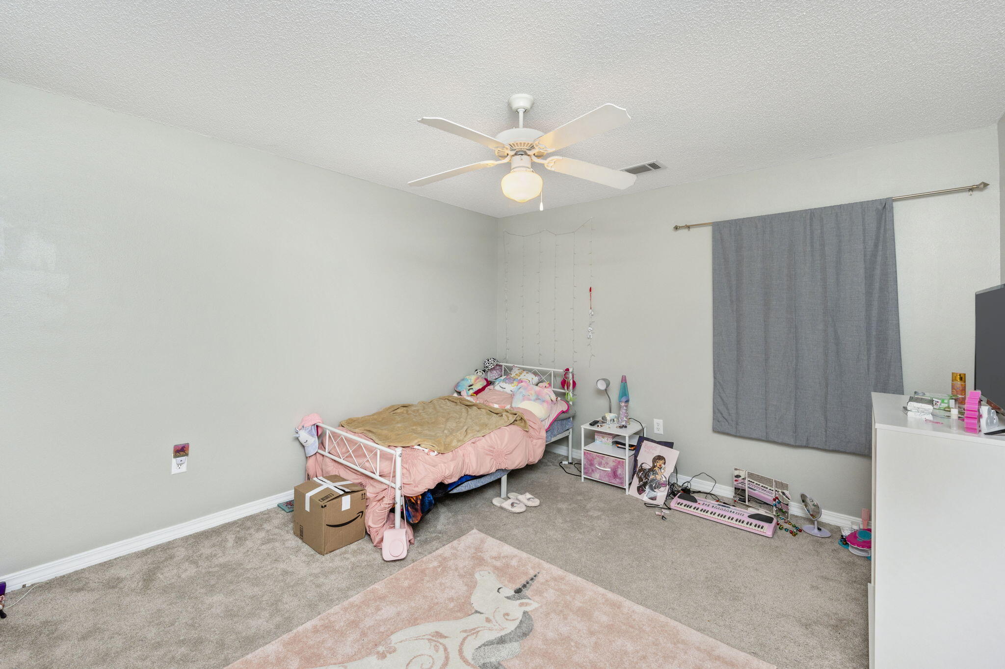 2139 Tom Street Navarre, FL 32566 - Photo 7 of 32 a room with toys and a chandelier fan