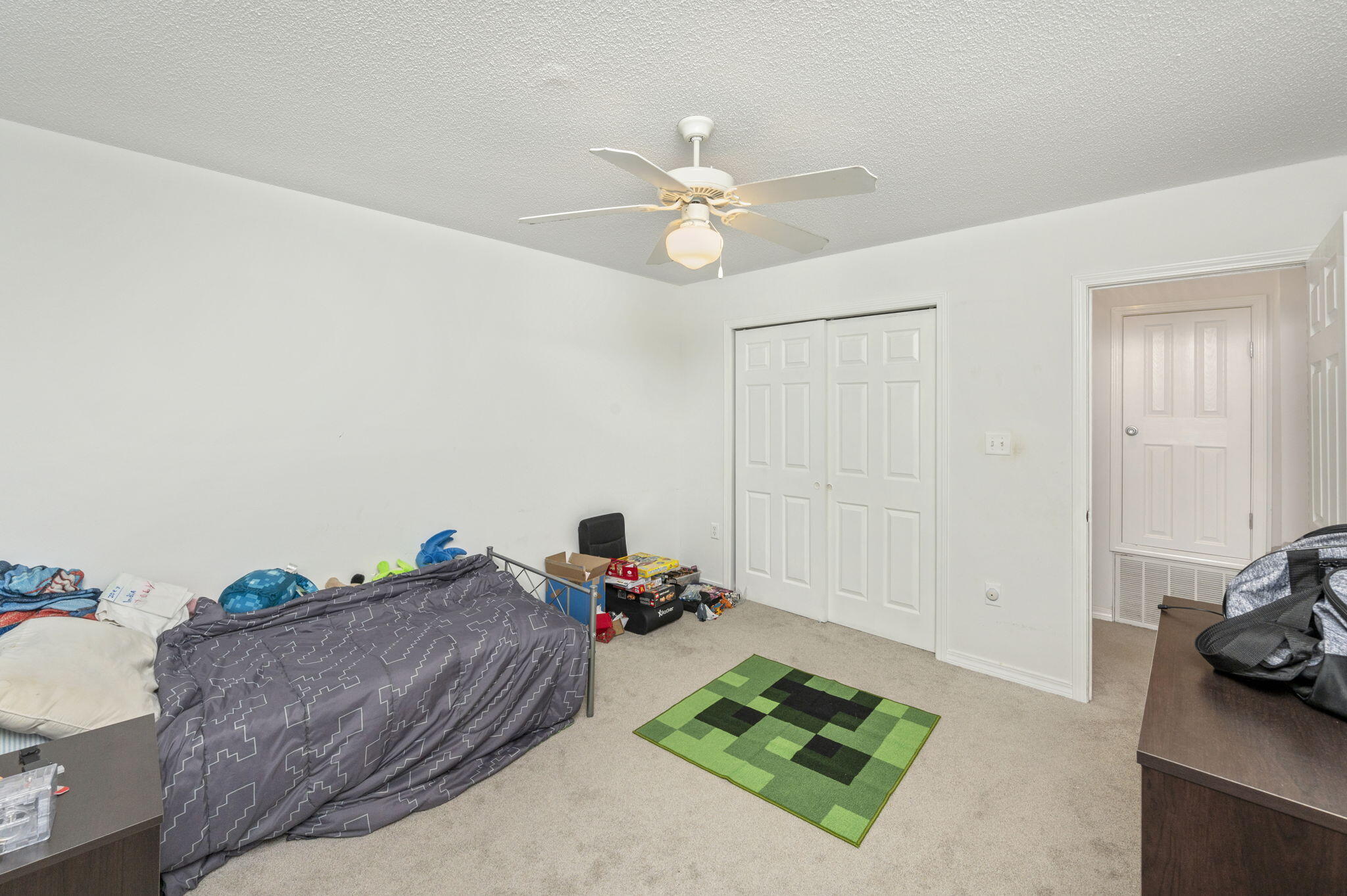2139 Tom Street Navarre, FL 32566 - Photo 8 of 32 a bed room with a bed and a chandelier