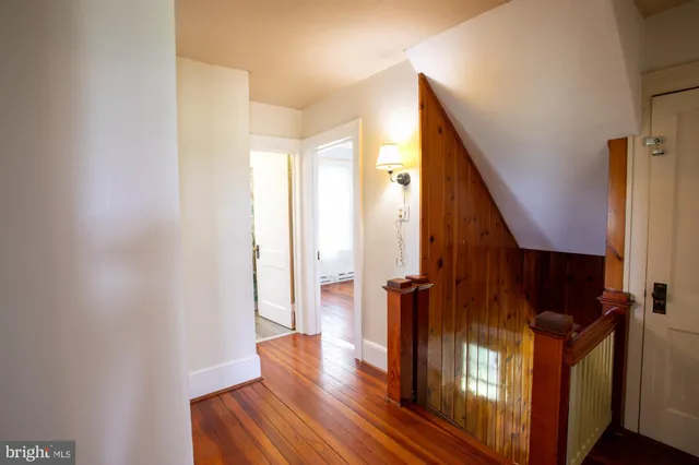a view of front door with wooden floor