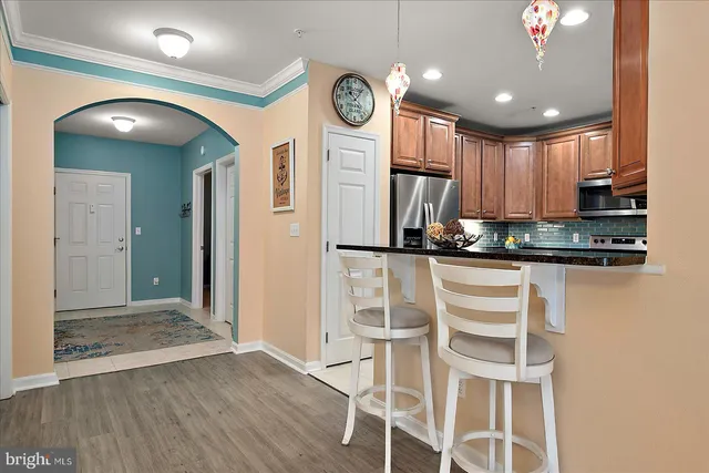 a bedroom with a bed and wall painting