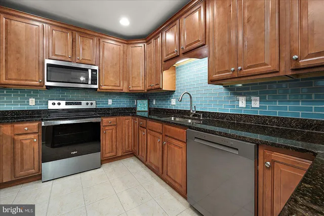 an aerial view of residential houses with outdoor space and swimming pool