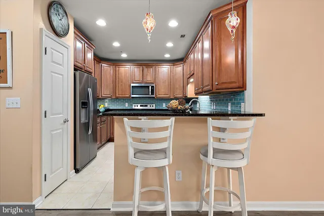 a front view of a house with a yard table and chairs