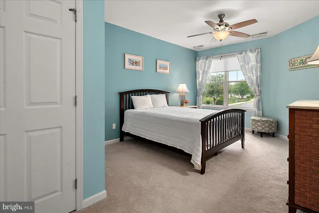 a view of a two chairs and a table in a yard