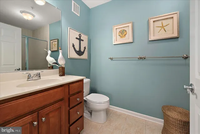 an aerial view of lake and residential houses with outdoor space