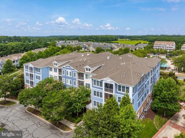 a view of a hallway with wooden floor and a fireplace