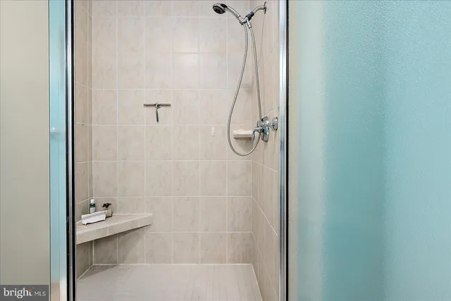 a view of a balcony with wooden floor and seating space