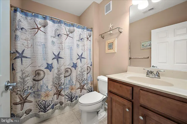 an aerial view of residential houses with outdoor space and river