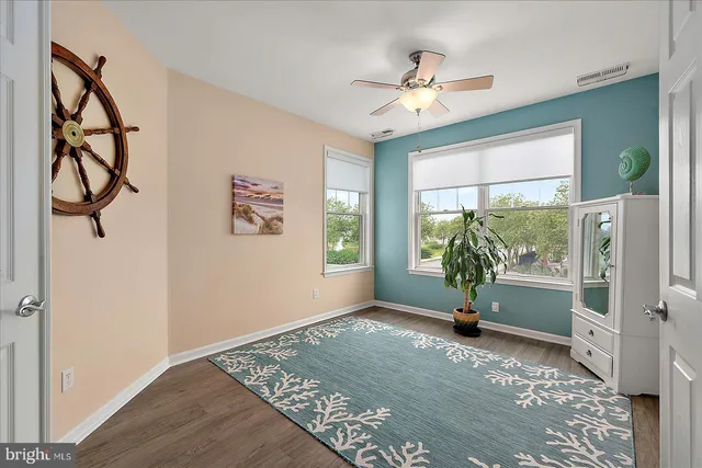 an aerial view of residential houses with outdoor space and river