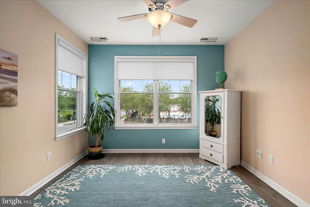 an aerial view of residential houses with outdoor space and river
