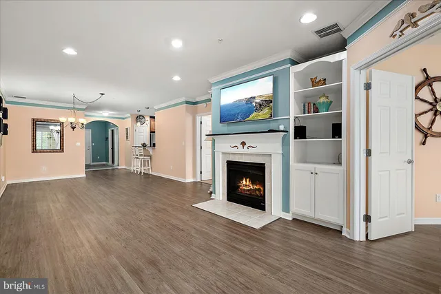 a kitchen with granite countertop wooden cabinets and stainless steel appliances