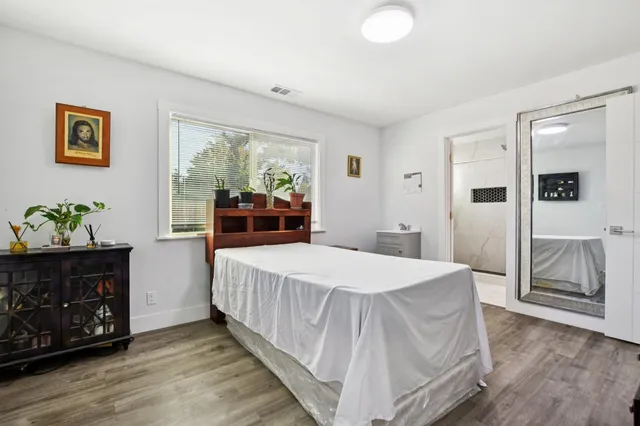 a bedroom with a bed and a dresser